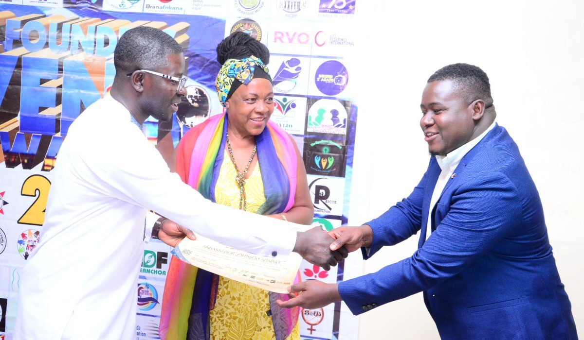 Amb. Caius Eze presenting awards